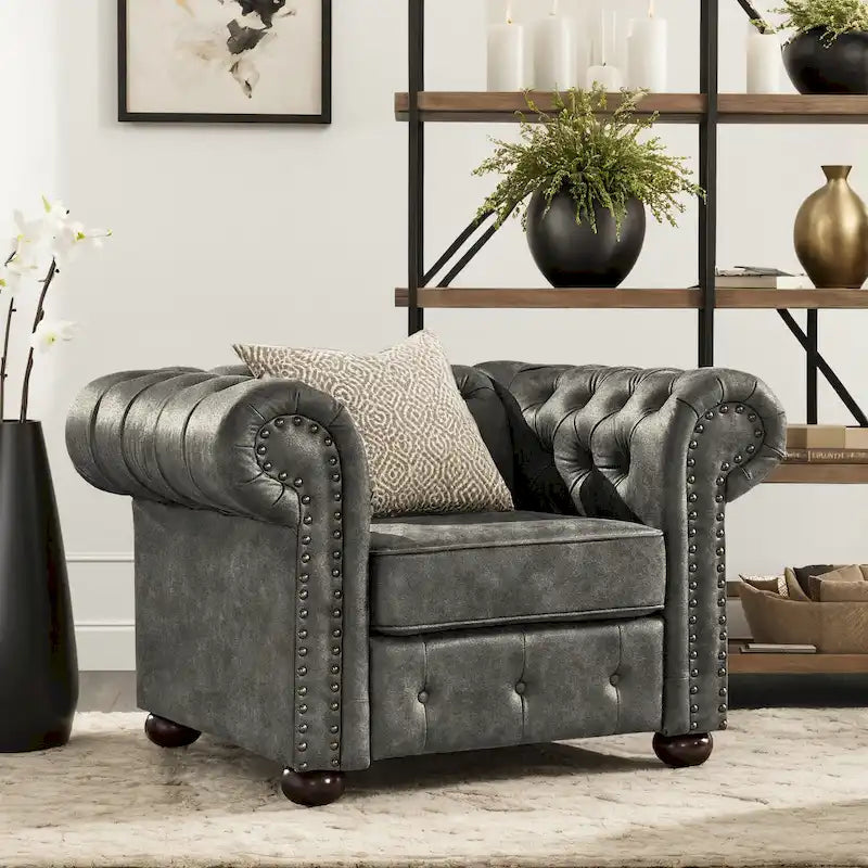 Fauteuil touffeté à bras roulés