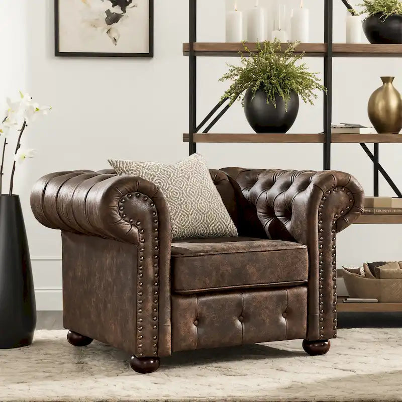Fauteuil touffeté à bras roulés